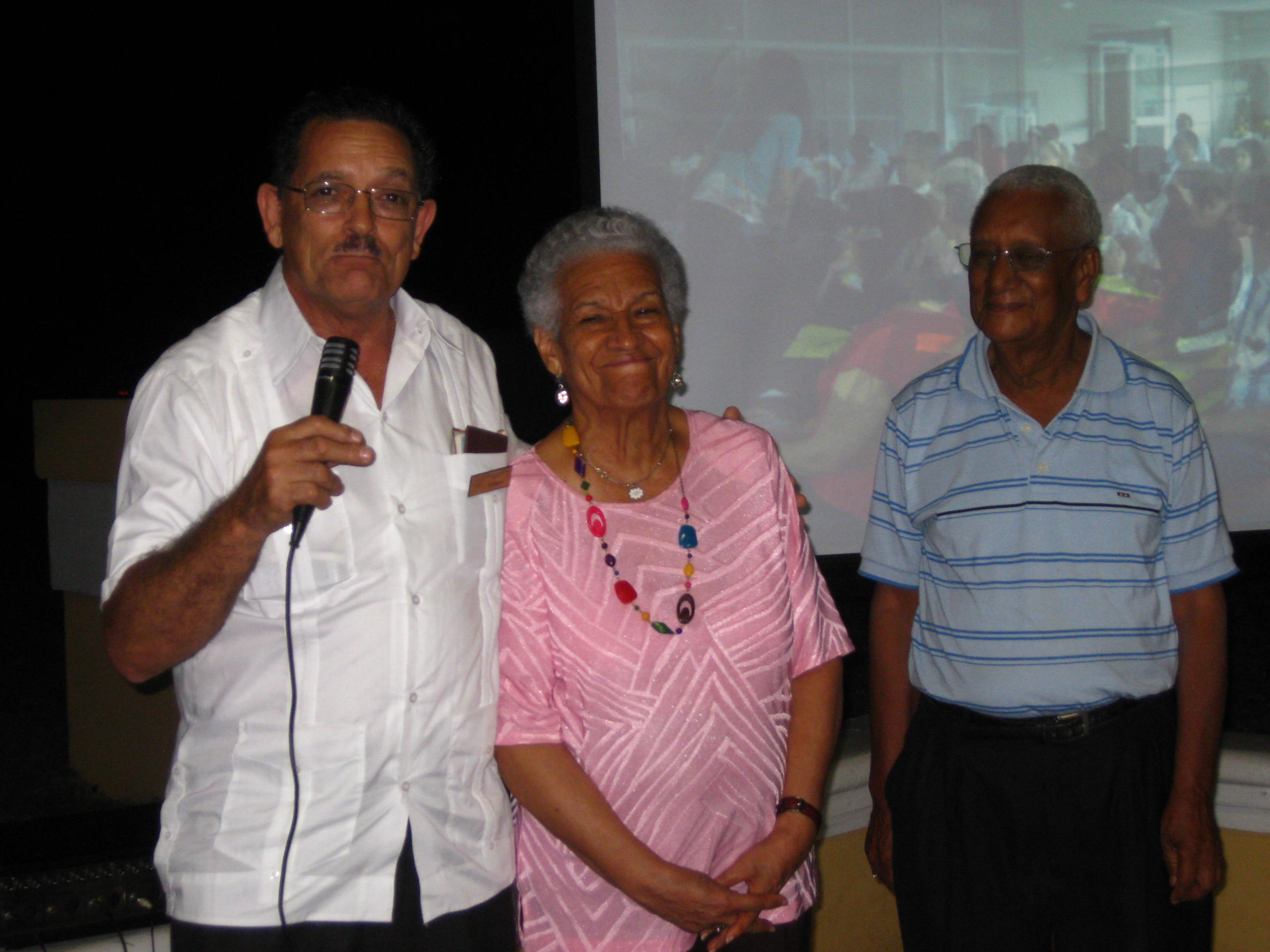 The Dominican Republic celebrated its 50th national convention this year with the participation of three early members of its National Spiritual Assembly. Ana Daisy Garcia, center, was elected in 1961, and she is also serving as a member now. At left is Felix Gomez, a member of the first assembly who later moved to Puerto Rico and served on the assembly there, too. At right is Rafael Benzan, a member of the regional assembly for the Caribbean that preceded the individual national assemblies. He was first elected to the national assembly in the Dominican Republic in 1962.