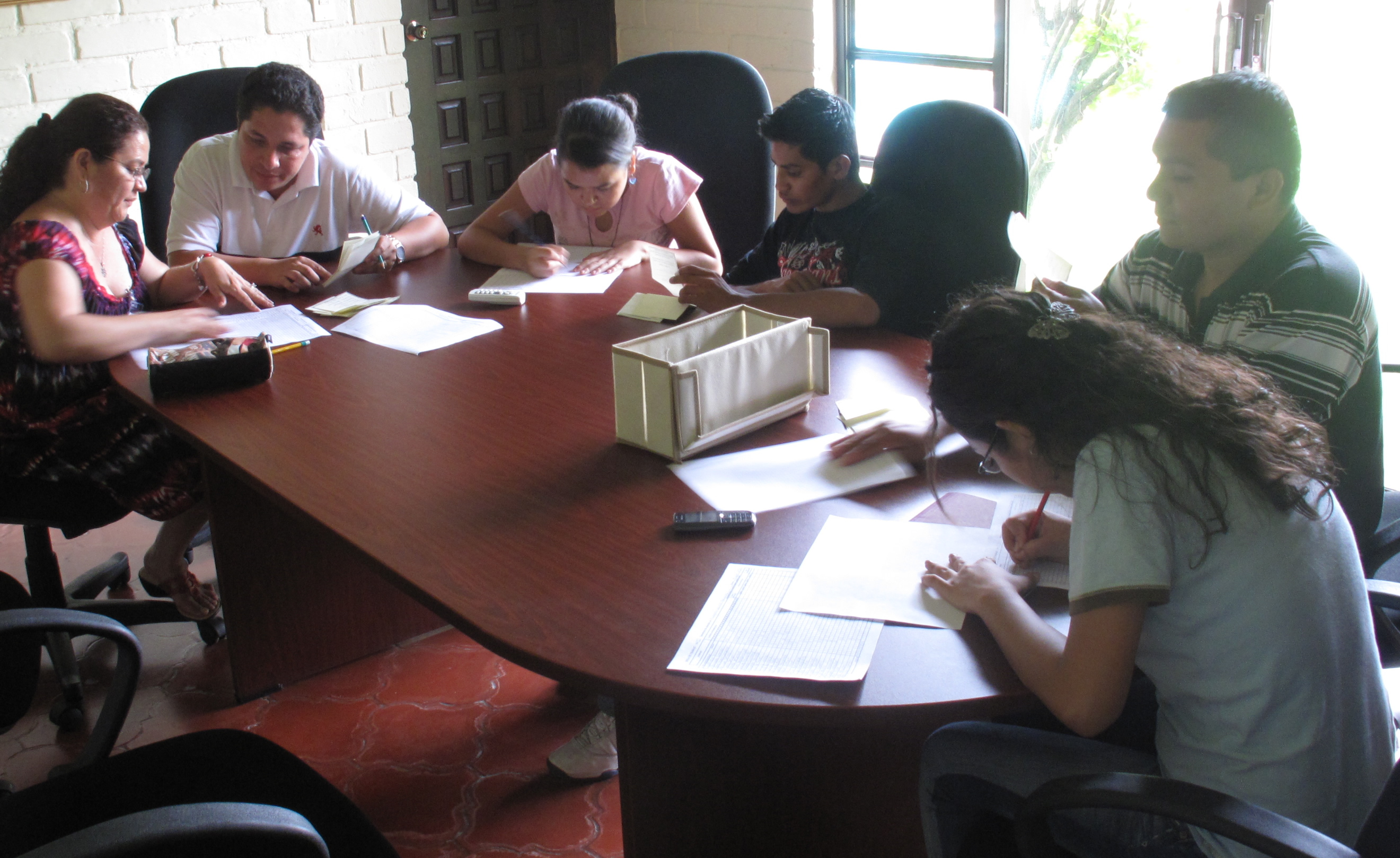 The tellers count the ballots during the 50th election of the National Spiritual Assembly of El Salvador.