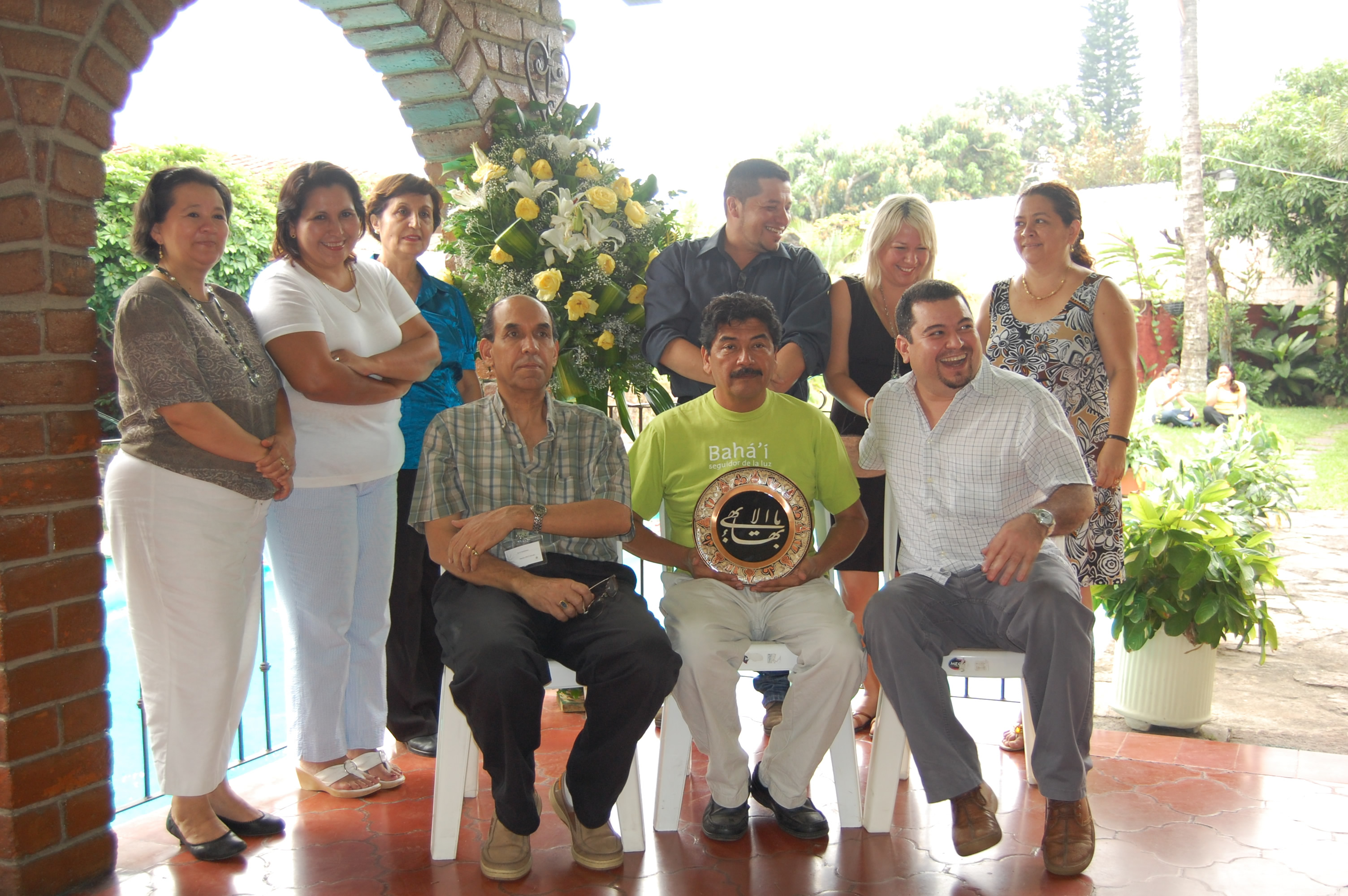 Members of the National Spiritual Assembly prepare to have their first photograph taken as a group following their election on 24 April 2010.