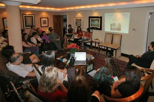 Guests at a home in Brasilia view an online presentation by Tahirih Naylor, a Baha'i International Community Representative to the United Nations, as part of the World E-Conference on Culture of Peace and Sustainability.