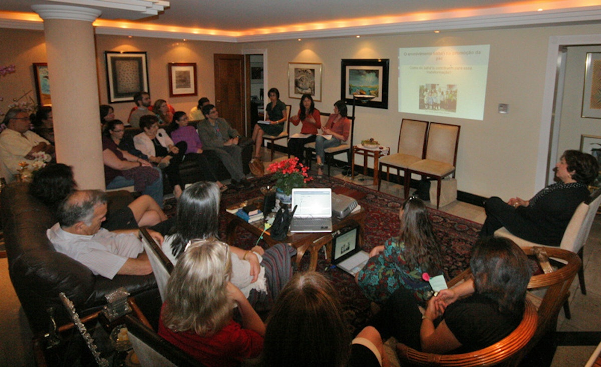 Guests at a home in Brasilia view an online presentation by Tahirih Naylor, a Baha'i International Community Representative to the United Nations, as part of the World E-Conference on Culture of Peace and Sustainability.