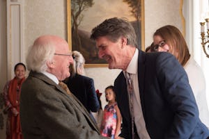 Irish President Michael Higgins greets members of the Baha’i community at the reception for the bicentenary.