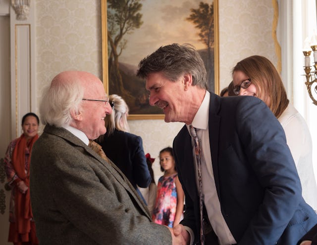 Irish President Michael Higgins greets members of the Baha’i community at the reception for the bicentenary.