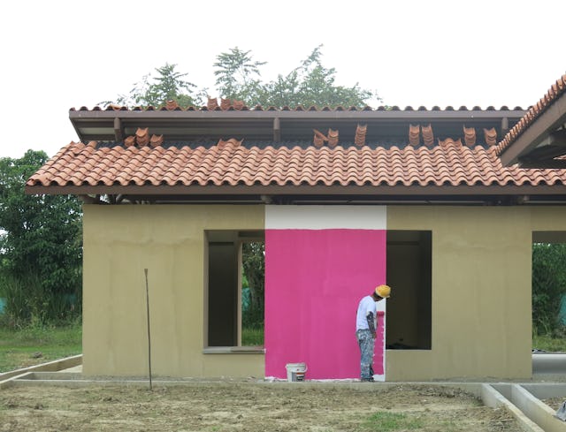 Ancillary buildings at the House of Worship in Norte del Cauca are being painted in vibrant colors.