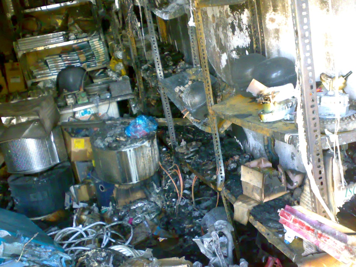 The interior of a home appliance sales and repair shop, owned by a Baha'i in Rafsanjan, after an arson attack on 15 November. Damage exceeding tens of thousands of US dollars was caused.