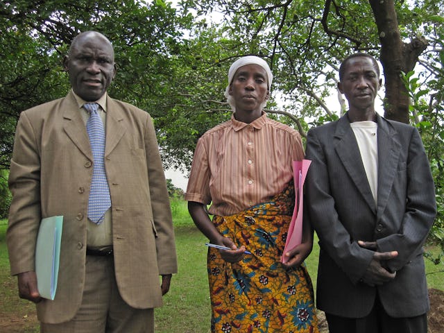 Three Batwa people who attended the first national convention in 17 years of the Baha'is of Burundi. From left to right: Delphin Sebitwa – who was among the nine people elected to the National Spiritual Assembly, Christine Ndayikengurutse, and Cyriaque Mpawentmana.
