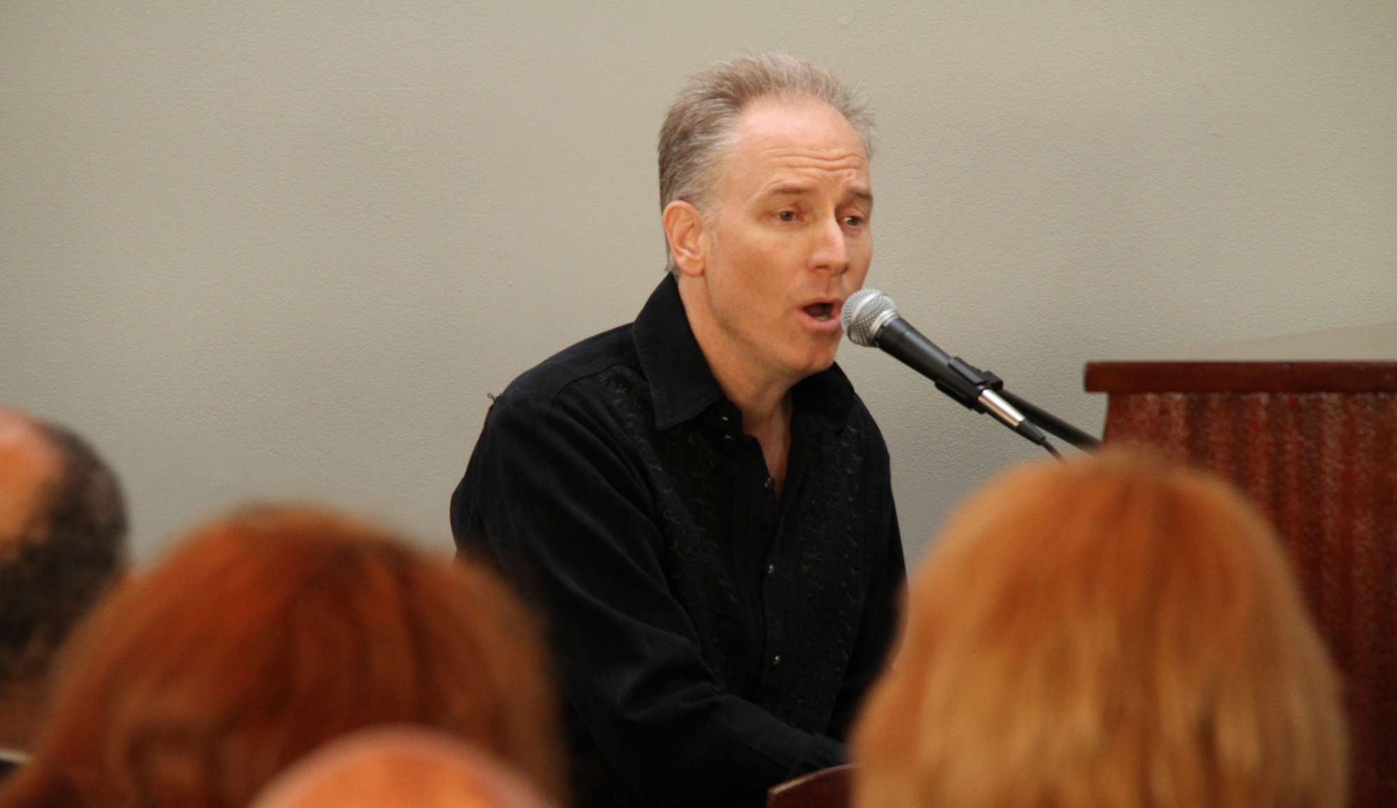 Grammy award-winning musician KC Porter sings his new composition, titled "Yaran" – dedicated to the seven Baha'i leaders – at a reception marking the third anniversary of their arrests, held on 12 May in Washington D.C.