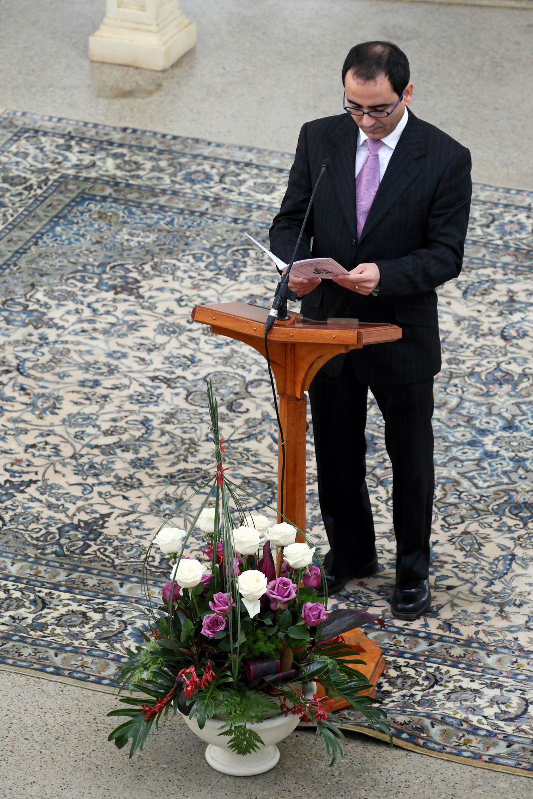 Mehrzad Mumtahan – a nephew of Baha'i prisoner, Saeid Rezaei – reading a prayer at a special service in the Baha'i House of Worship, Sydney, Australia. The programme, held on Sunday 15 May, included extracts from diverse religious scriptures on the theme of justice.
