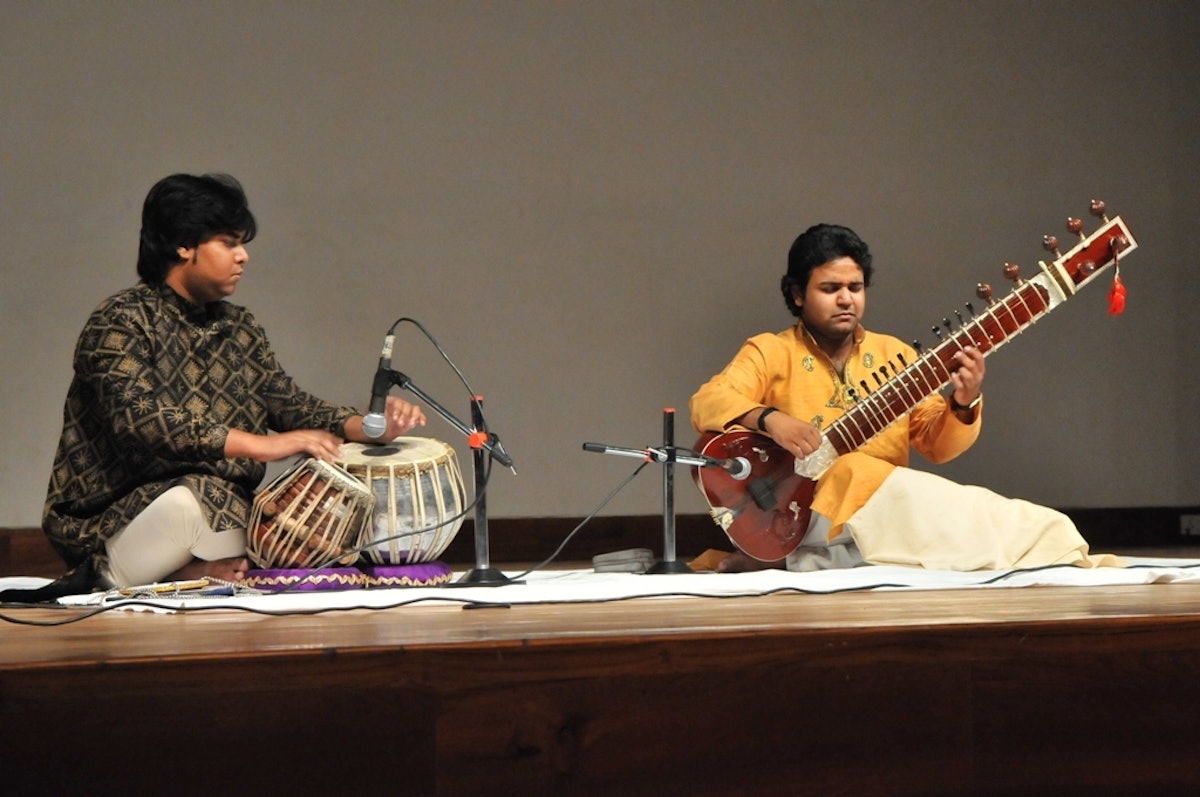 Sitar master, Azeem Ahmed Alvi, pictured right, performing at a solidarity concert held at the Baha'i House of Worship in New Delhi, 18 May 2011, to mark the third anniversary of the arrest of Iran's seven Baha'i leaders.