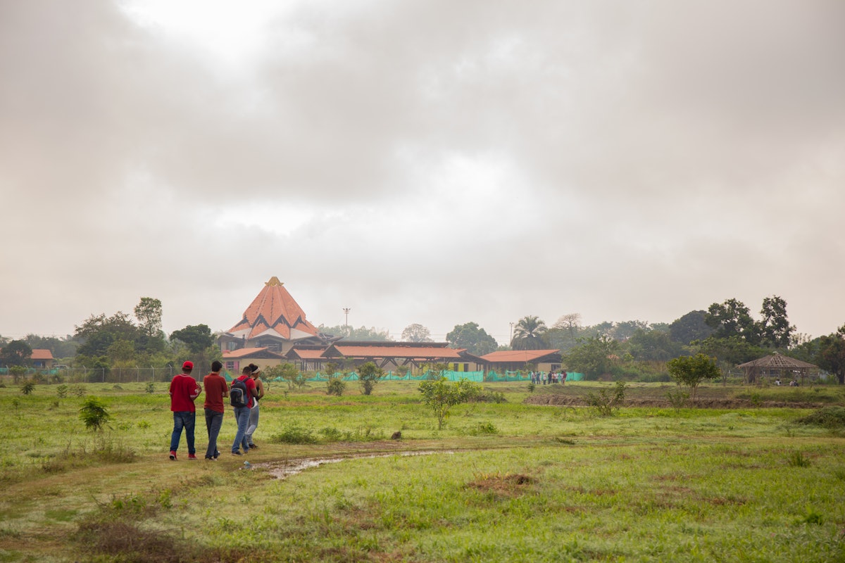 Members of the community walk in the grounds around the Temple. The land here has already become a haven for visitors to find peace, to meditate, and to enjoy the beauty of the natural habitat.