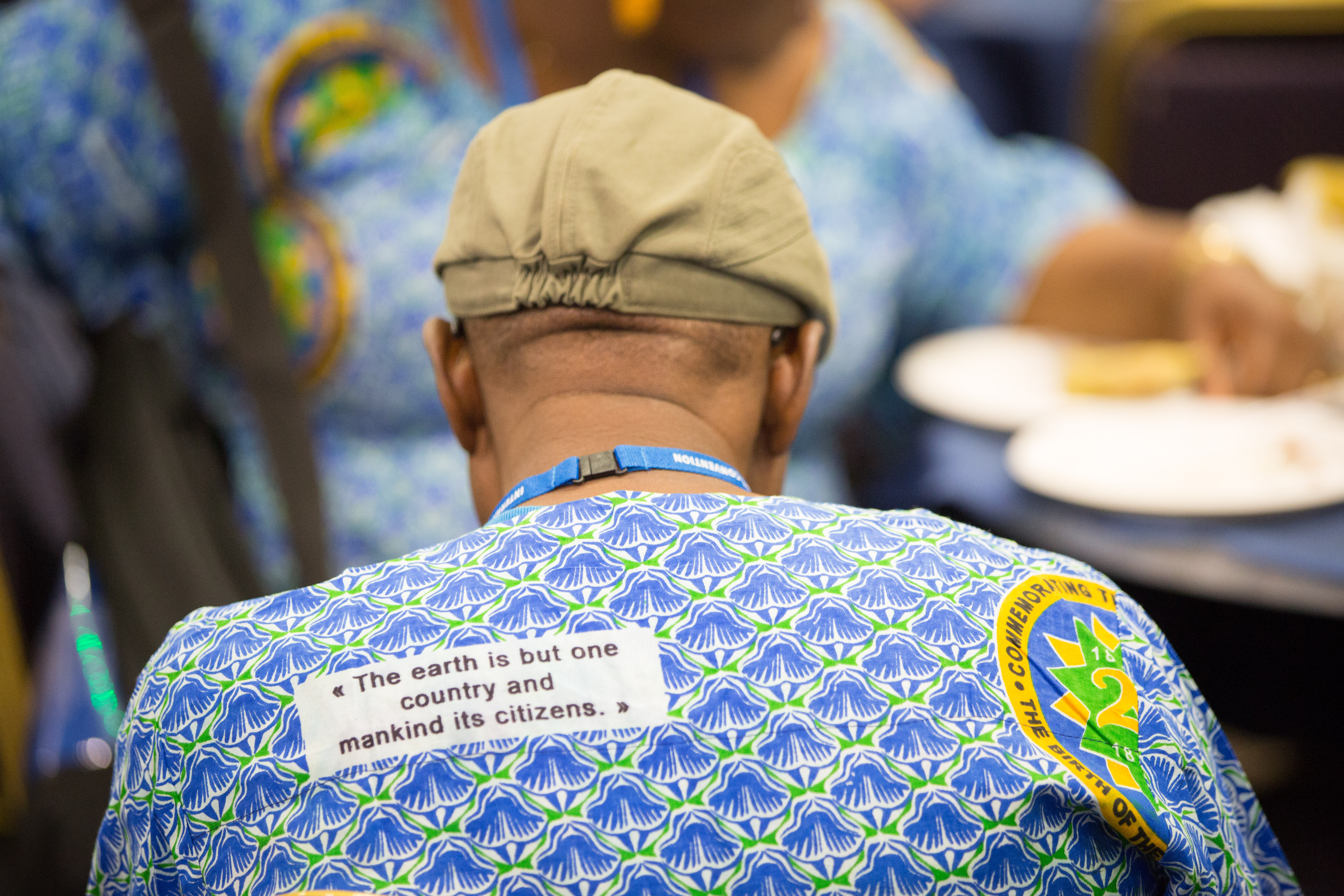 A delegate wears an outfit made from a West African cloth for the bicentenary of the birth of Baha’u’llah.