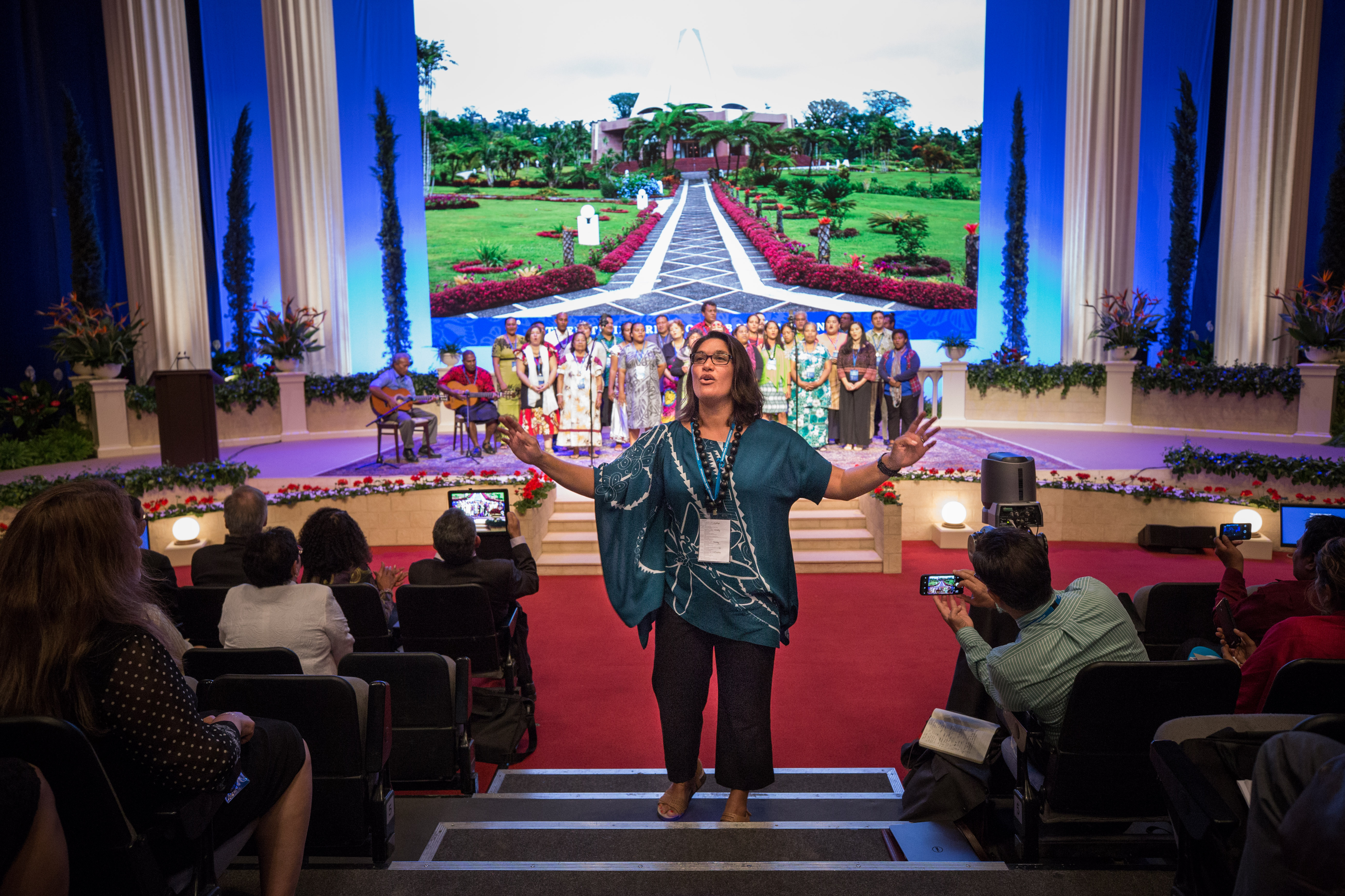 A musical presentation from delegates from the Pacific region expanded to include all present in the auditorium.