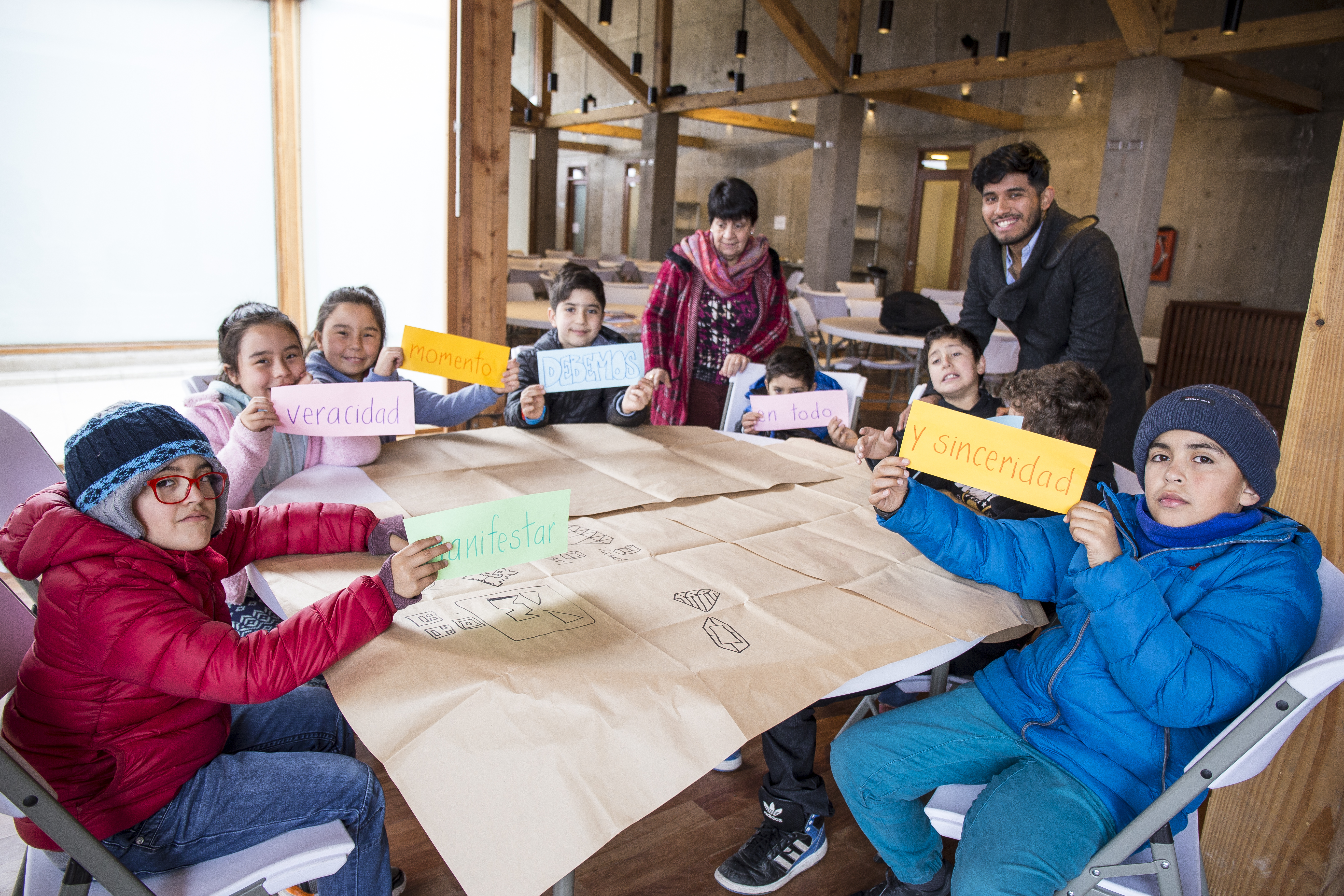 Children participate in a moral and spiritual education class held in one of the buildings on the Temple grounds.