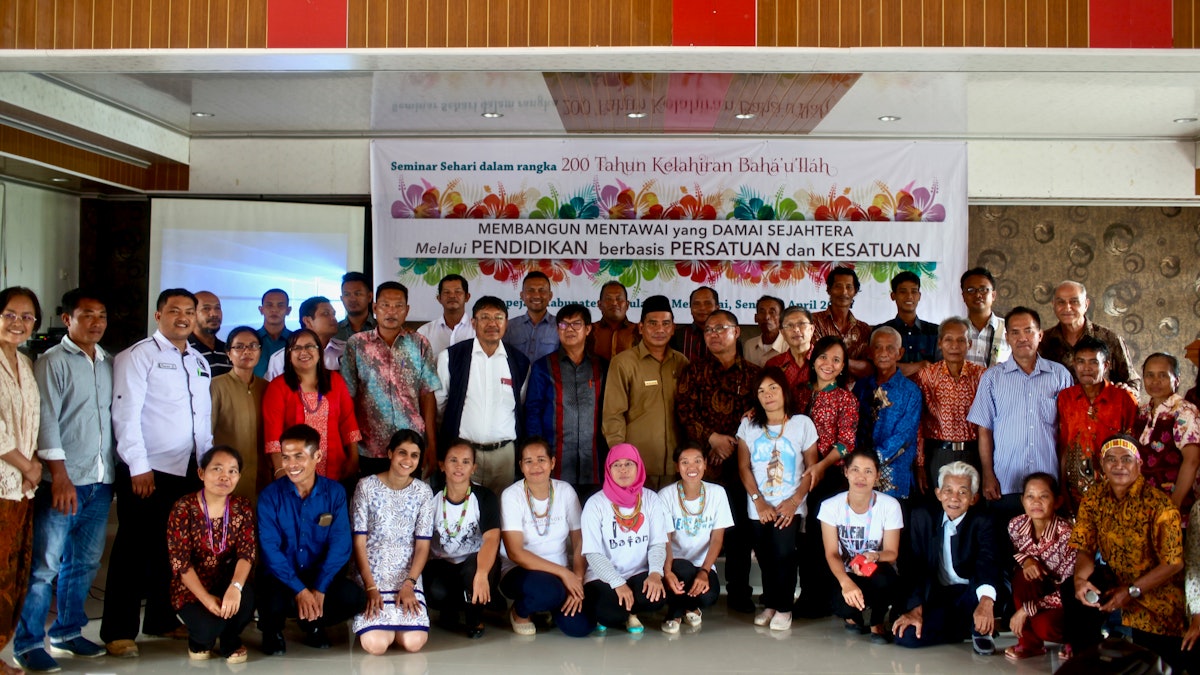 Participants at the seminar, “Building a peaceful and prosperous Mentawai through education based on unity and oneness,” gather for a group photograph.