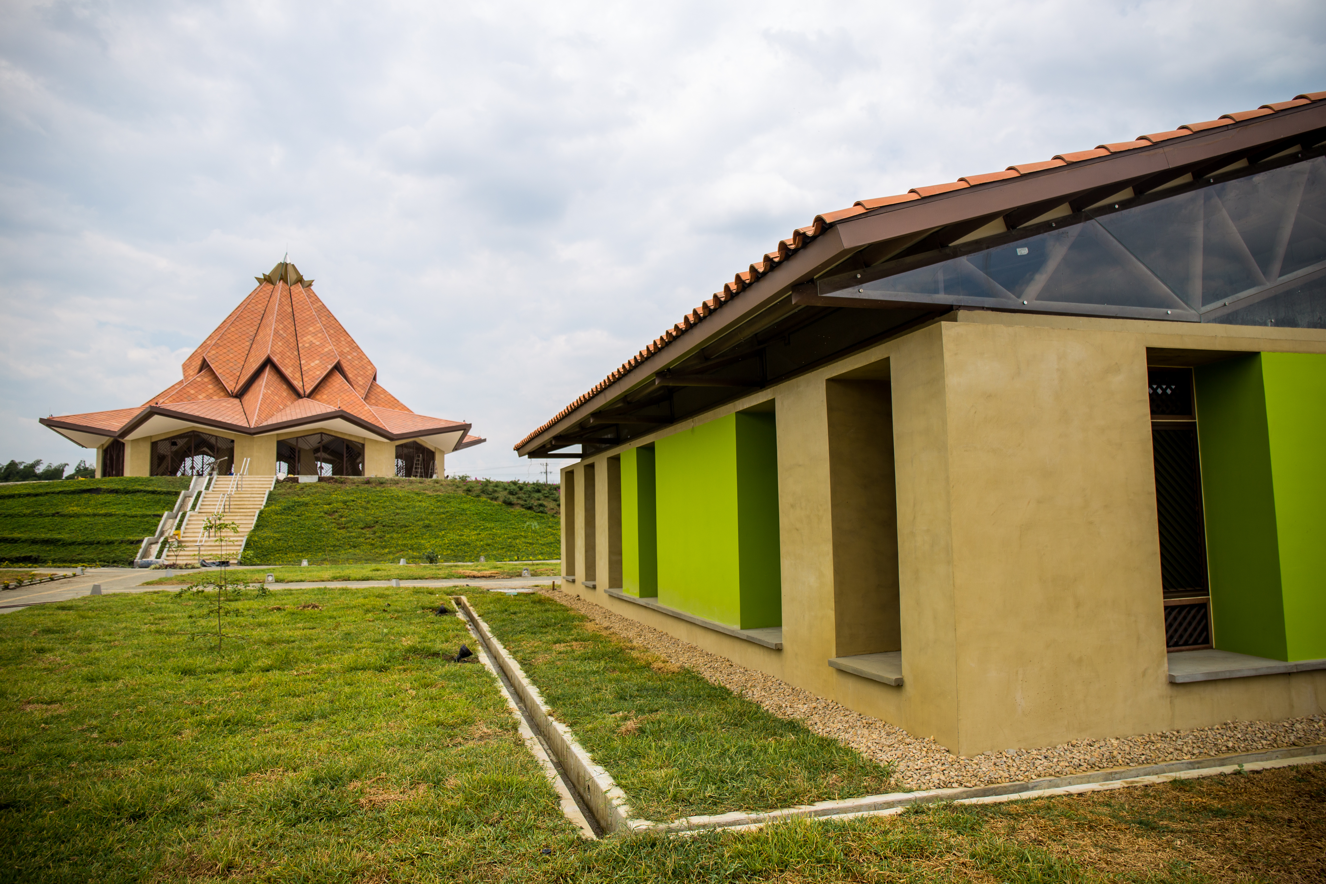 A number of ancillary structures surround the Temple. They are painted with bright colors, a feature of the region's architecture.