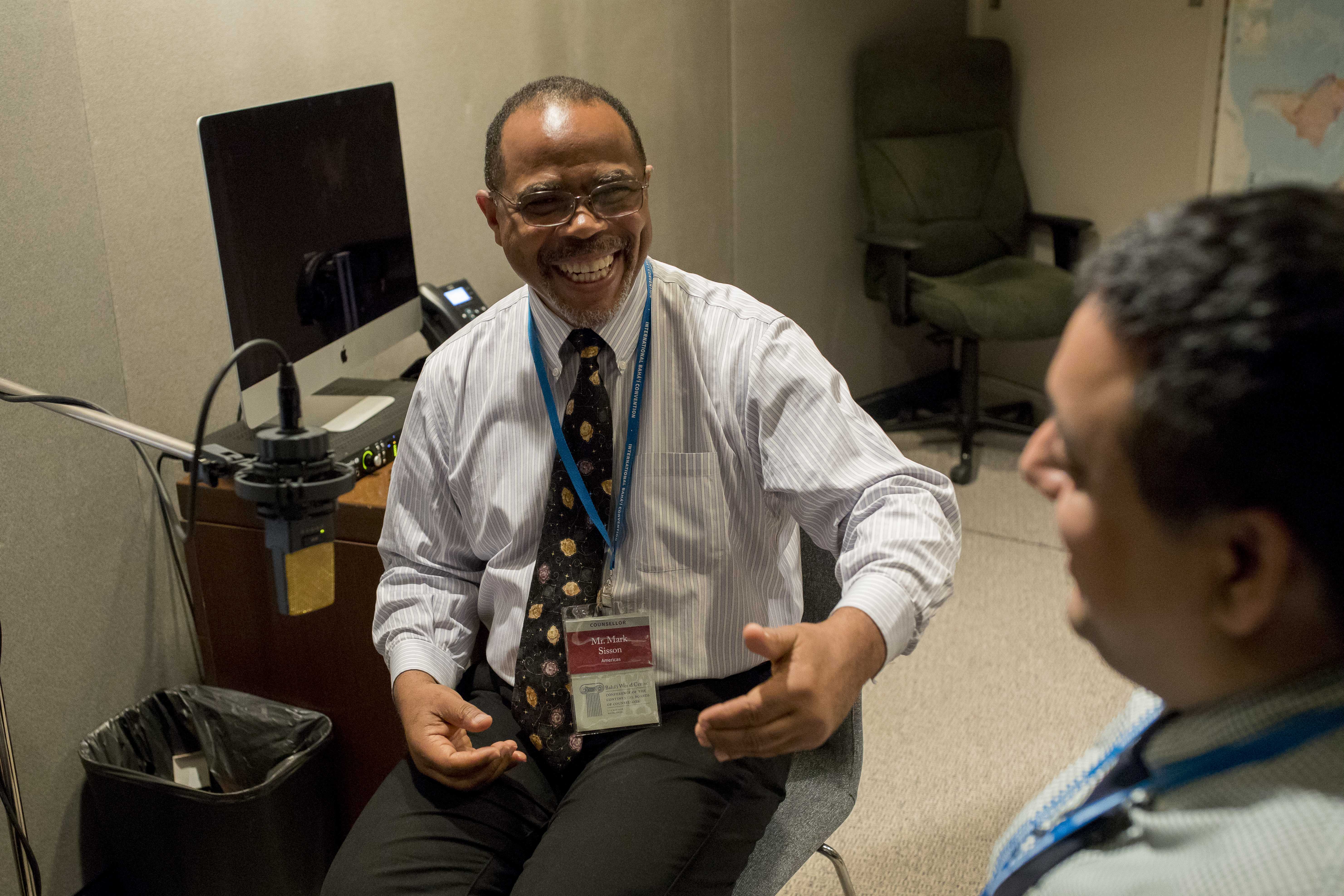 Mr. Sisson (left) shares about experiences from the United States as Mr. Nadarajah listens.