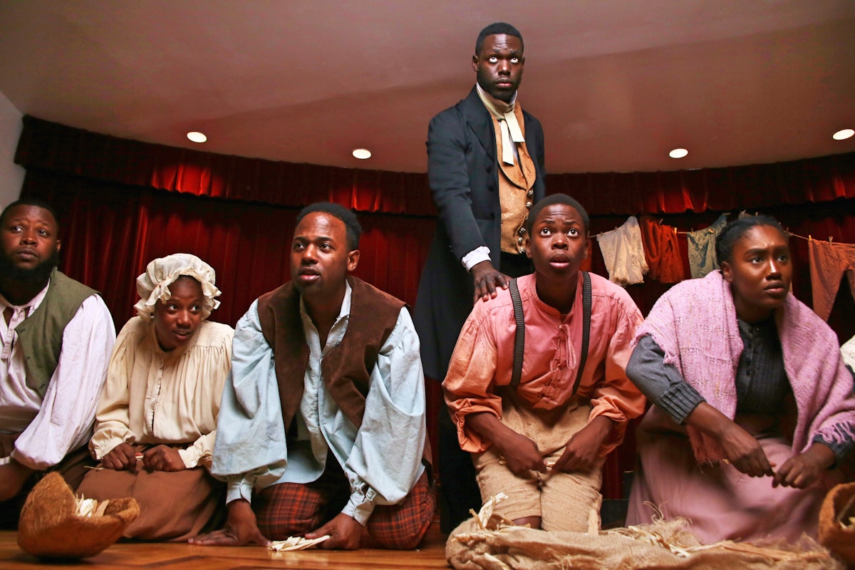 This photo captures a scene from Henry Box Brown. The musical draws on the rich legacy of 19th-century spirituals, which arose out of the suffering and hardships endured by enslaved peoples of African descent. These pieces often convey deep spiritual values and insights.“All these songs have come from oppression, from forgiveness of the oppressors, songs that distracted you from the brutality of the life that you were in, ”explains the show’ s musical director and co - composer.“All of these songs are connected to God…”