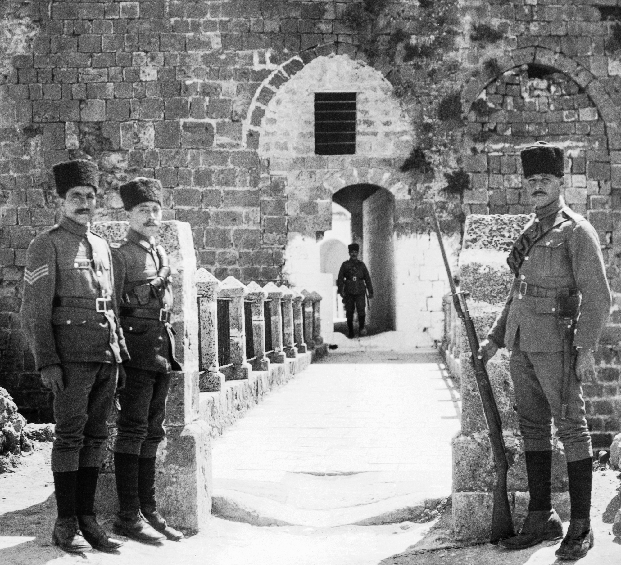 This photo, taken around 1900, shows prison guards in front of the barracks, where Bahá’u’lláh was taken as a prisoner on 31 August 1868.