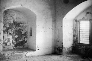 This 1921 photo shows the prison cell in which Bahá’u’lláh was kept for more than two years from 1868 to 1870. It was here where he revealed some of the messages to the kings and rulers of the world.