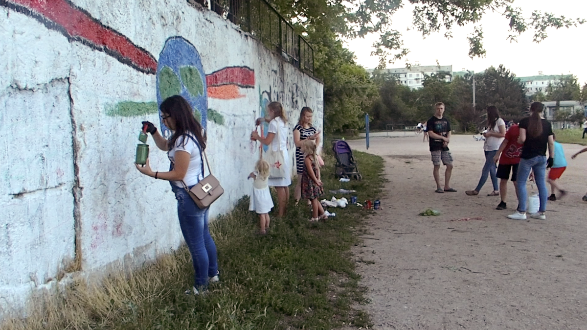 The new films include one about efforts at nurturing younger generations. This scene shows people from a community in Moldova gathering to participate in a service project.