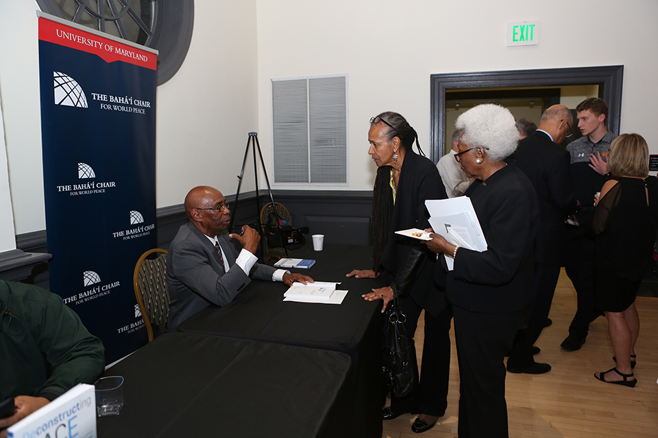 Dr. Mahiri speaks with audience members after his talk.