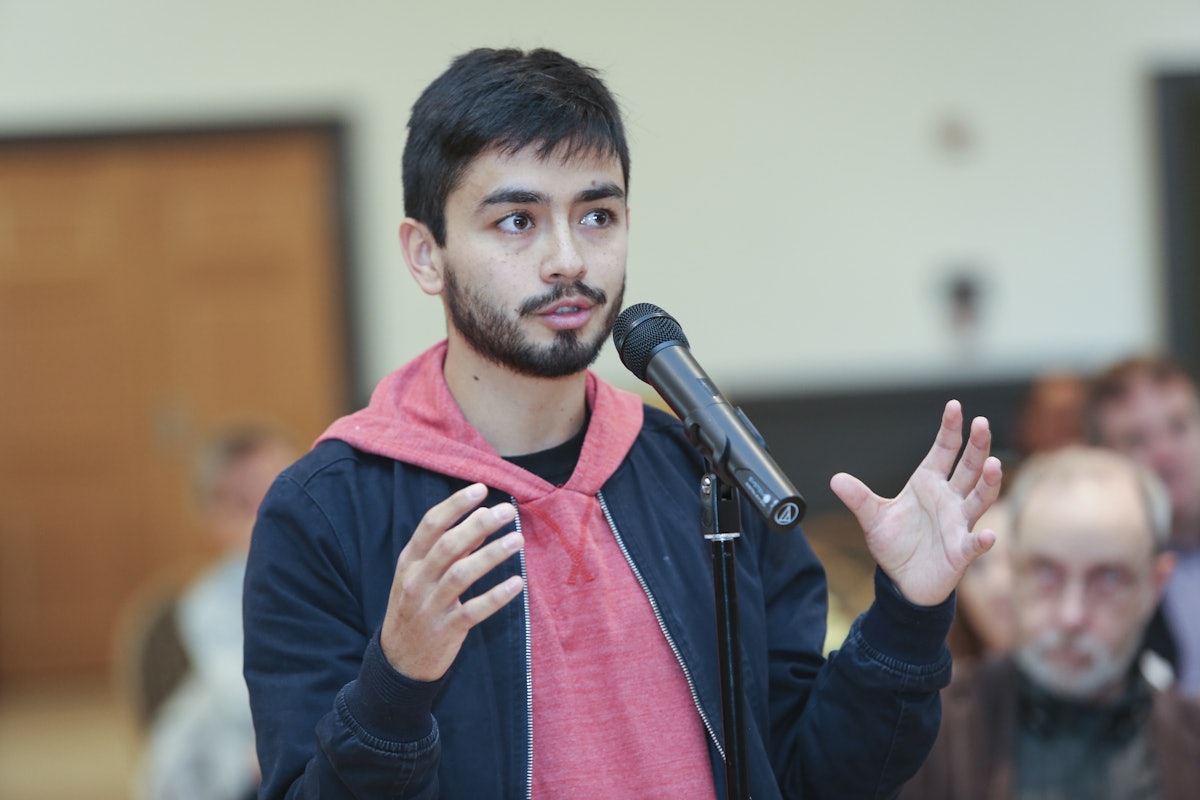 The conference’s lectures and panel discussions were followed by questions from participants in the conference. Here, a university student asks a question of one of the speakers.