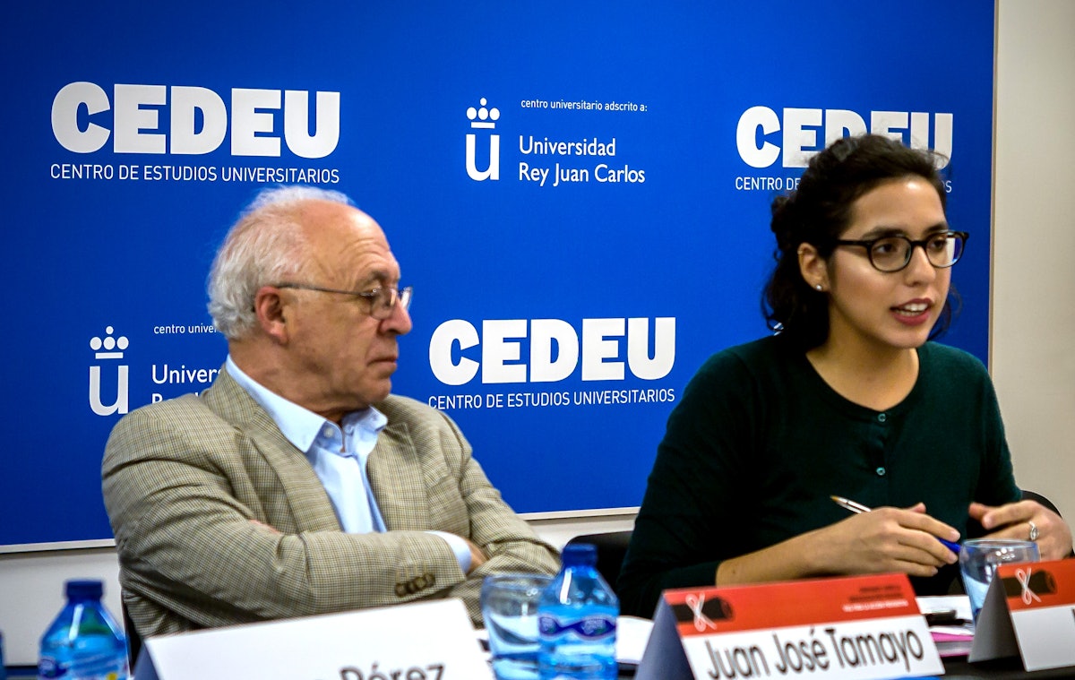 Leila Sant (right) of the Spanish Baha’i community’s office of public affairs speaks on a panel about the causes of violent radicalization while Juan Jose Tamayo, theologian and director of the Chair of Religious Studies of Carlos III University, listens.