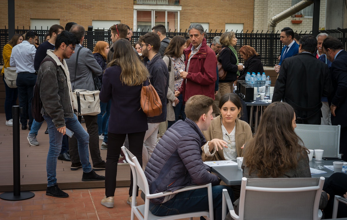 The dynamic conversations took place in the formal and informal settings of the conference. Here, attendees speak during a break.