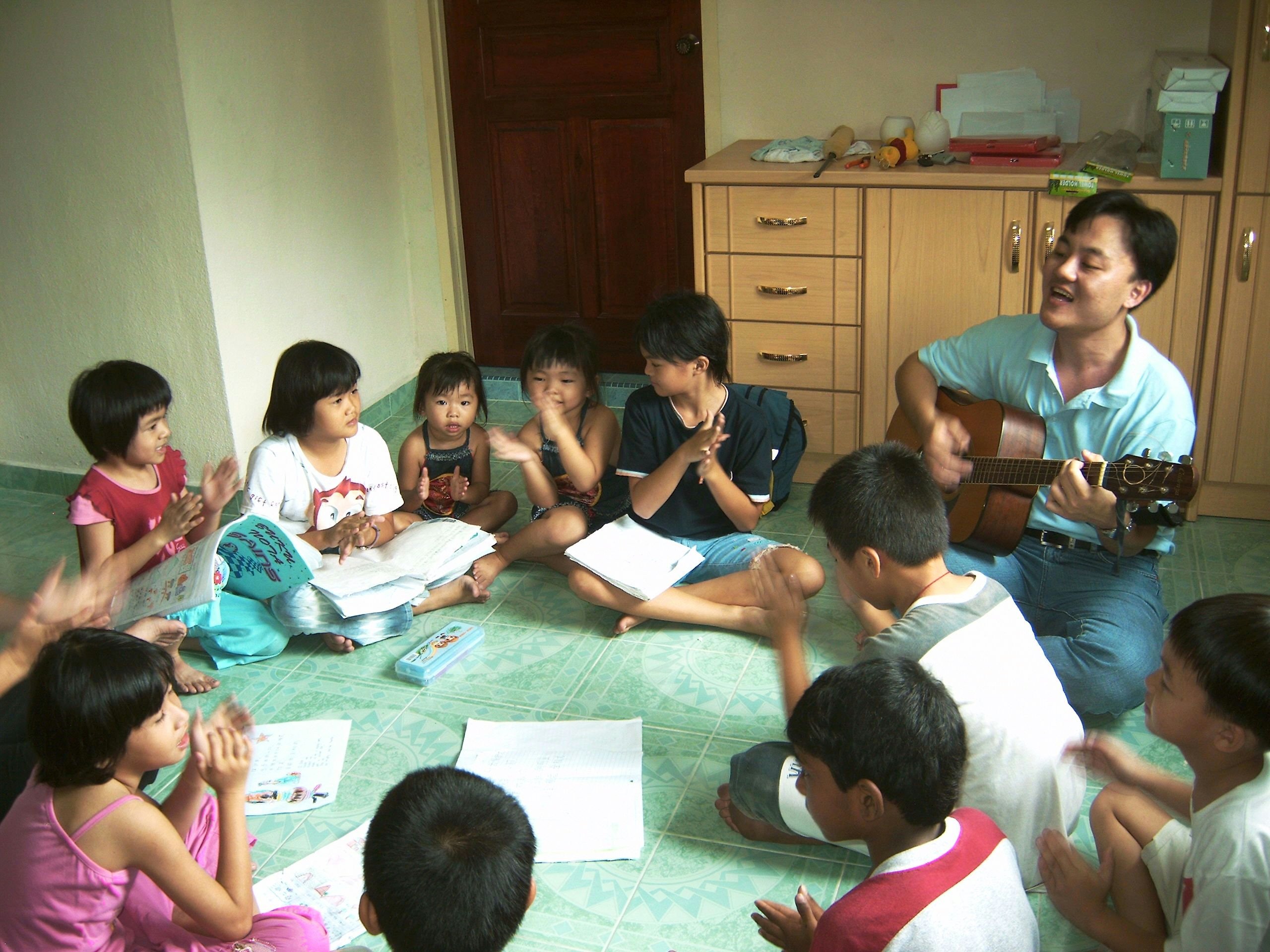 Video: Mr. Lim leads a song during a class in his home village of Jenjarom. He teaches classes for both children and young teens, sponsored by the local Baha'i community.