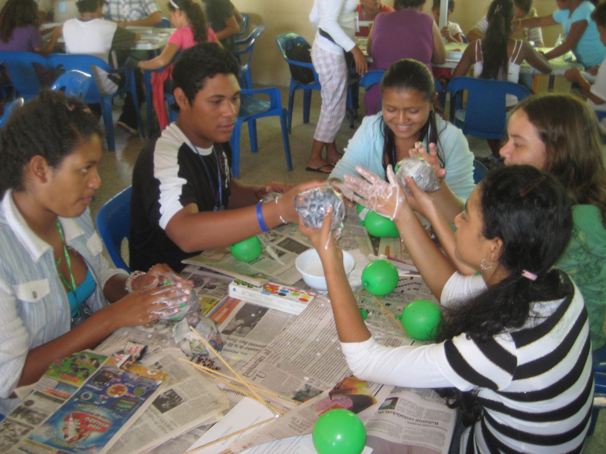In Venezuela, papier mache was the focus at one of the arts sessions at the summer school held each year at the Baha’i institute in Cabudare, near Barquisimeto. From left are Nohely Mendoza, Ali Morales, Lila Iguaran, Paola Alarcon, and Mariana Flores.