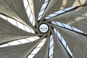 A calligraphic rendering of the invocation “O Glory of the All-Glorious” was lifted into position at the apex of the Baha'i House of Worship in Chile.