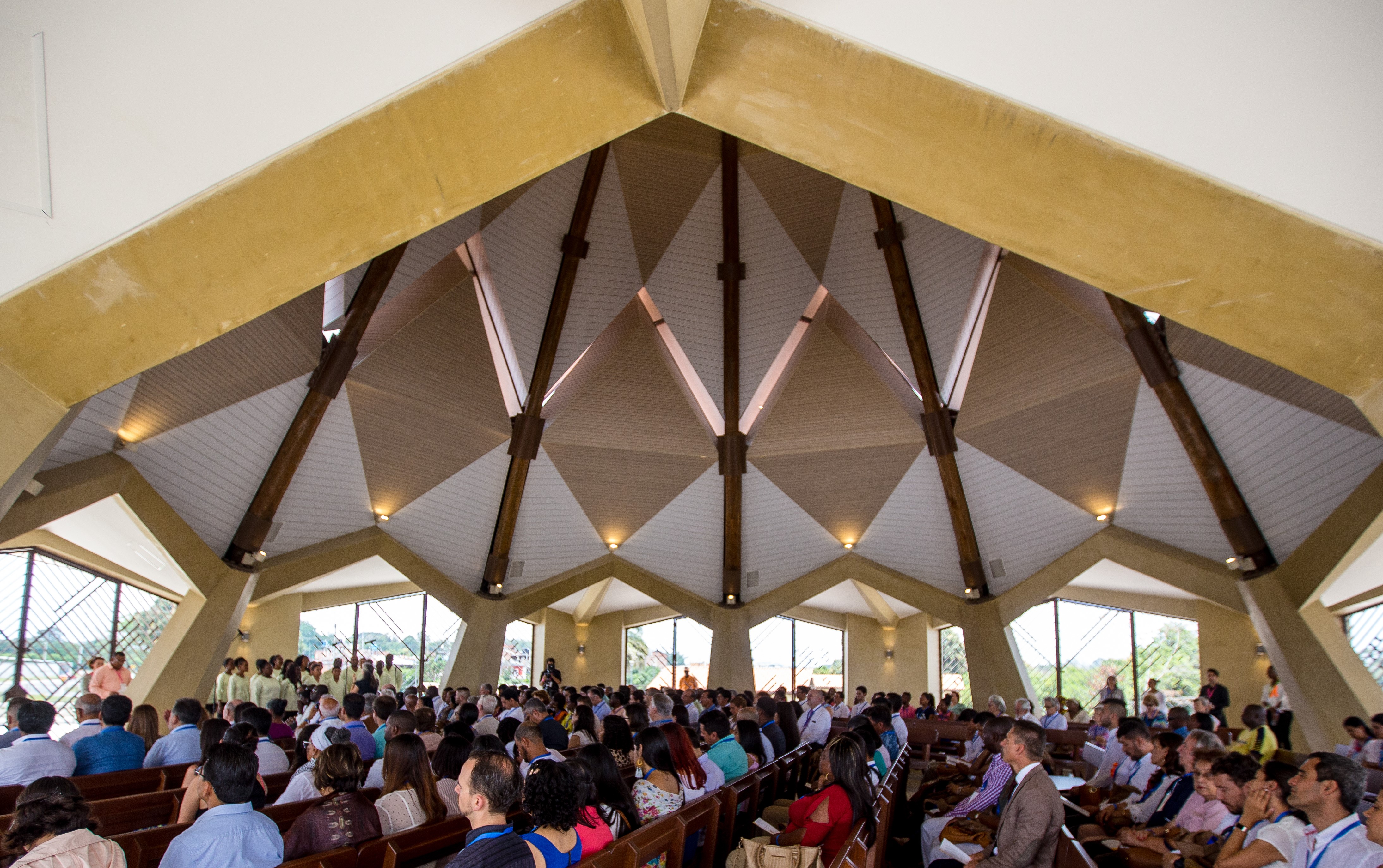 Participants sit inside the House of Worship for its first devotional program.