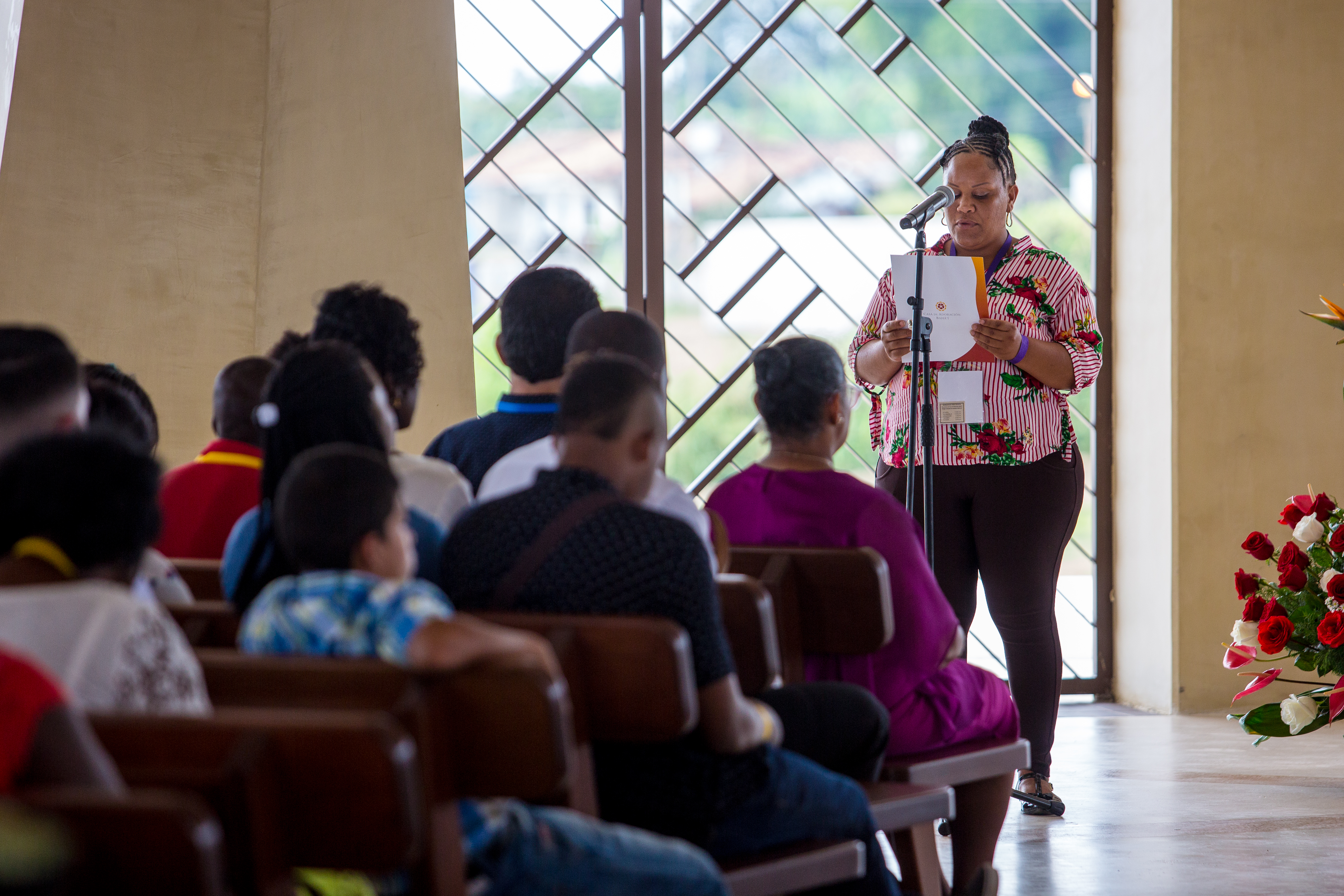 A woman reads a prayer during one of the devotional programs inside the Temple.