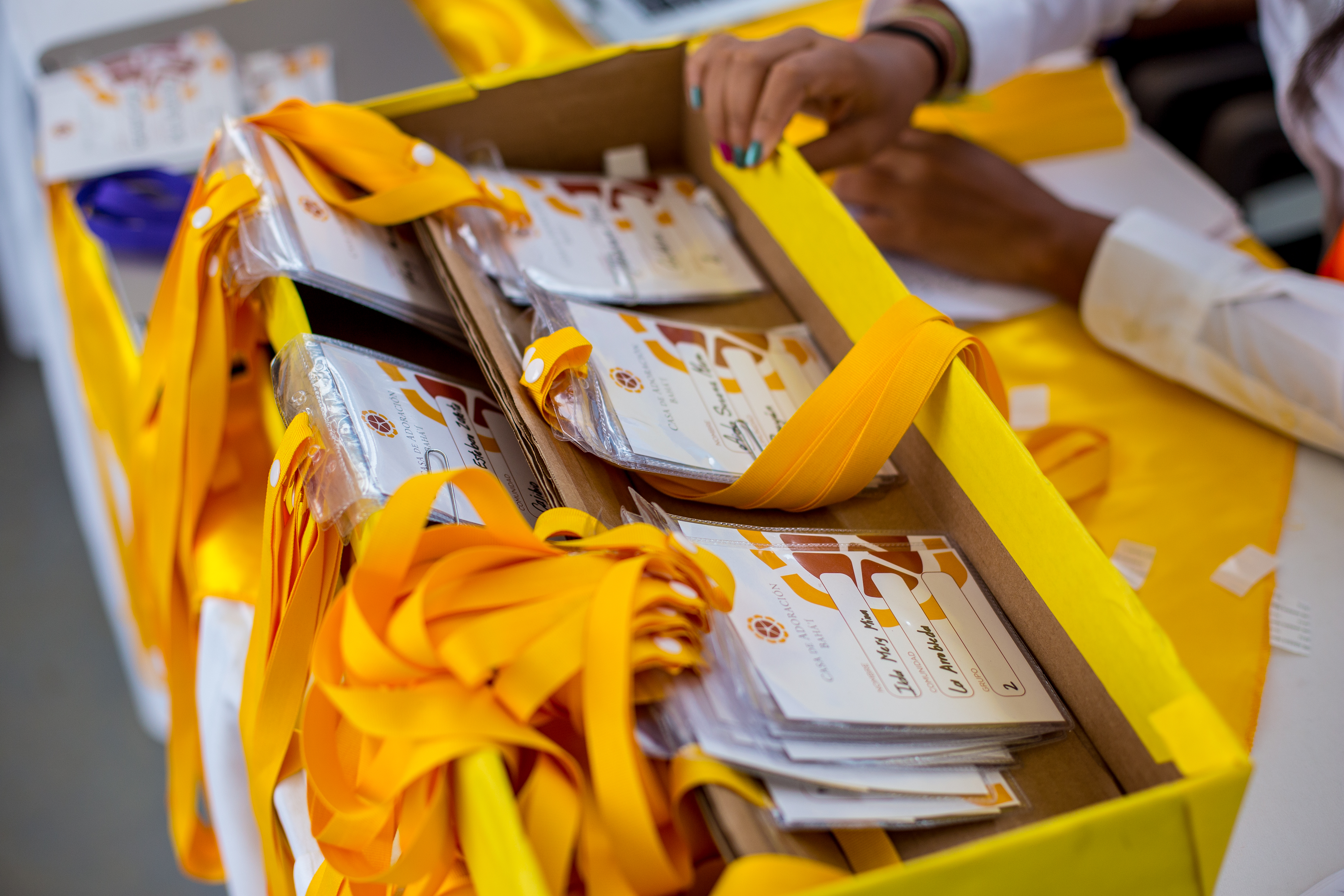 Volunteers carefully arranged name tags for the participants.