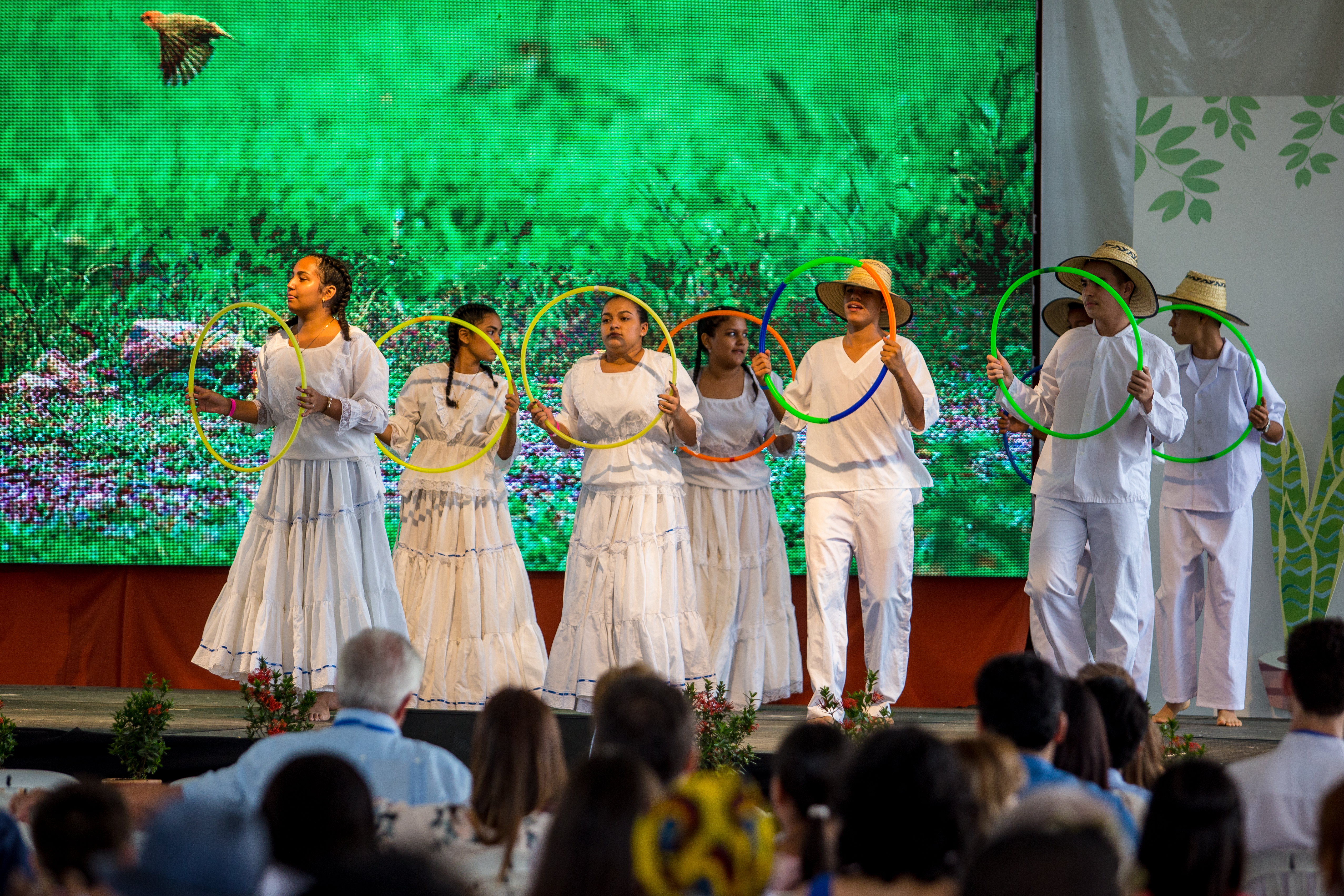 Young people perform on stage during the dedication ceremony.