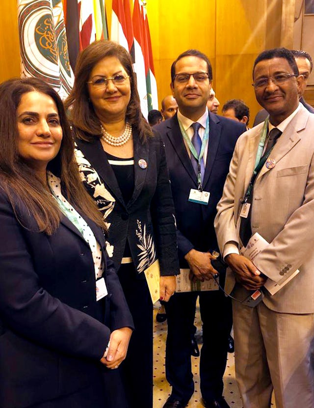 (From left) Shahnaz Jaberi, a Baha’i representative from Bahrain; Hala Al-Saeed, a government minister from Egypt; Hatem El-Hady, a Baha’i representative from Egypt; and Solomon Belay, a representative from the Baha’i International Community’s Addis Ababa office, at the Arab League headquarters in Cairo