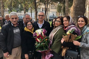 Afif Naeimi (center) stands with loved ones in Tehran earlier today after completing his unjust 10-year prison sentence.