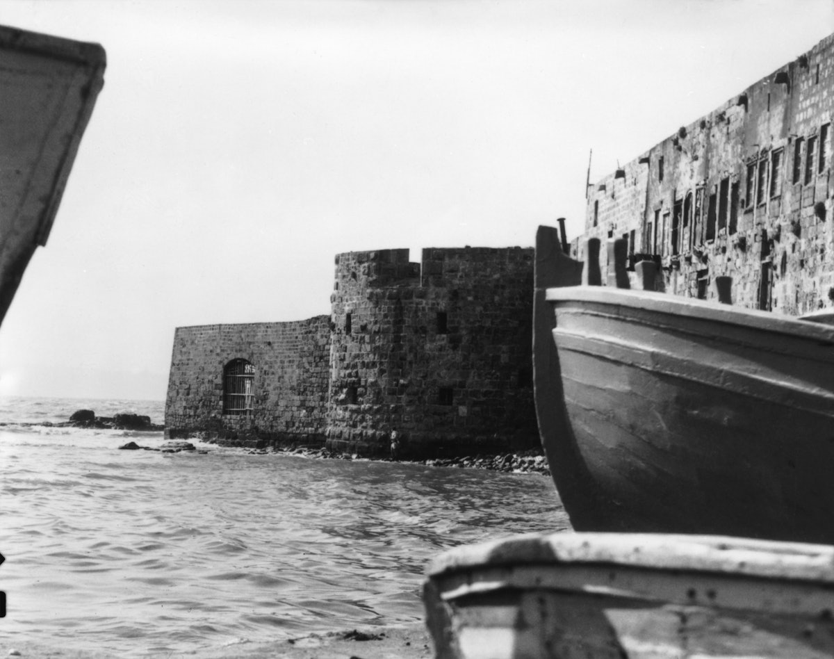 Baha’u’llah entered Akka on 31 August 1868 through the sea gate, which can be seen left of center along the sea wall. This photo, from 1920, shows what the sea gate would have looked like at the time of Baha’u’llah’s arrival, with water running directly to the wall. Today, this area along the old sea wall is a paved promenade.