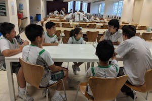 Two high school students support a group of middle school students as part of the school’s moral empowerment program.