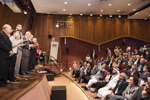 Venus Khalessi (second from left) of Australia’s Baha’i community reads from the closing statement of the G20 Interfaith Forum held in September in Buenos Aires, Argentina.