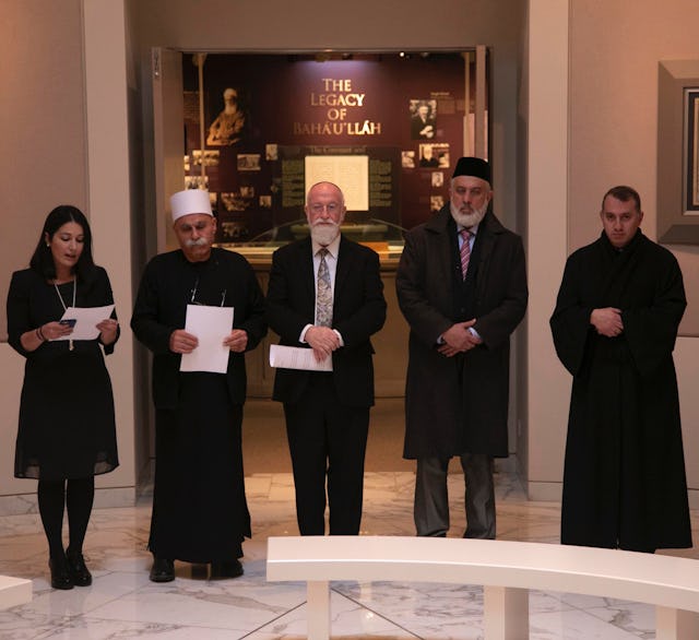 (From left) Carmel Irandoust, deputy secretary-general of the Baha’i International Community, reads a prayer as Sheikh Jaber Mansour, Rabbi David Metzger, Emir Muhammad Sharif Odeh, and Father Yousef Yakoub listen.