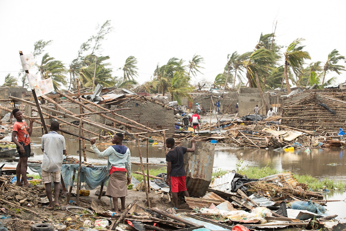 People trying to salvage what is left of their homes in the destroyed neighborhood of Praia Nova in Beira after the Cyclone Idai on 15 March. (Credit: International Federation of Red Cross and Red Crescent Societies)