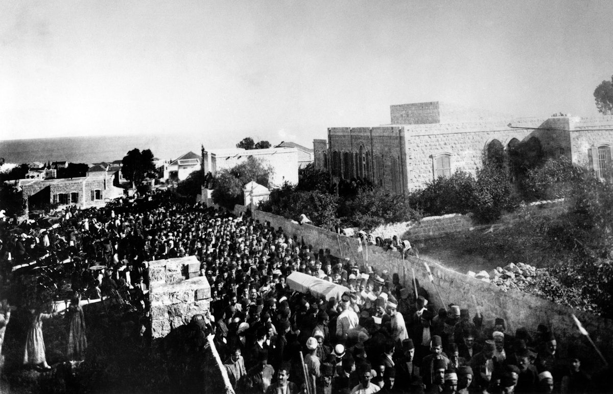 More than 10,000 people attended ‘Abdu’l-Baha’s funeral, held on 29 November 1921, the day after His passing. This photo shows the start of the funeral procession outside of ‘Abdu’l-Baha’s home in Haifa at the bottom of Mount Carmel. His remains were temporarily laid to rest in a vault inside the Shrine of the Bab. The House of Justice announced the construction of a permanent Shrine of ‘Abdu’l-Baha.