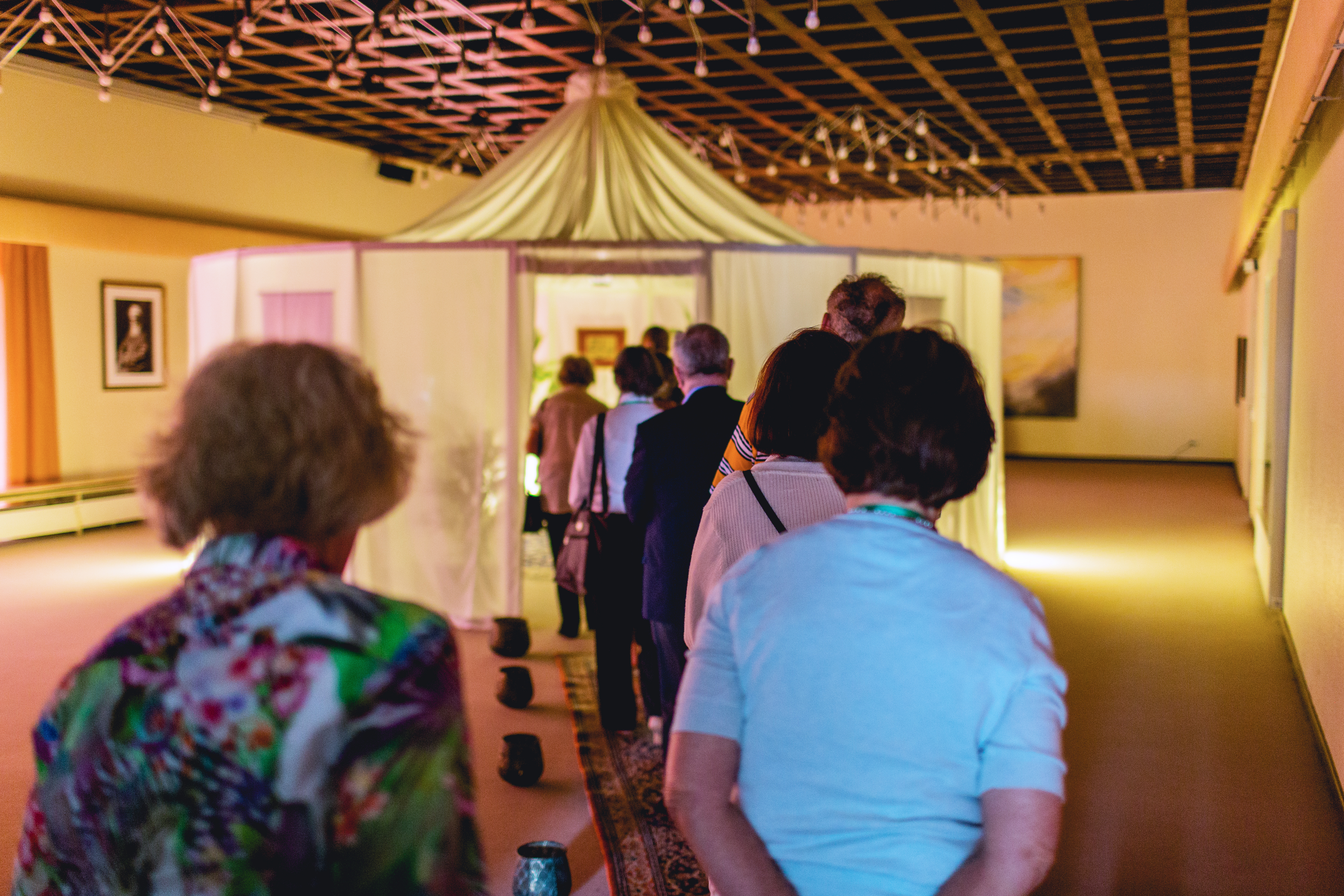 People line up to view a special exhibit of historic items related to the lives of the Bab and Baha’u’llah, displayed during the Ridvan period in Langenhain, Germany.