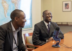 Charles Oloro (left) and Michael Okiria from Uganda speak about how growing numbers of people are attending regular gatherings for collective worship.