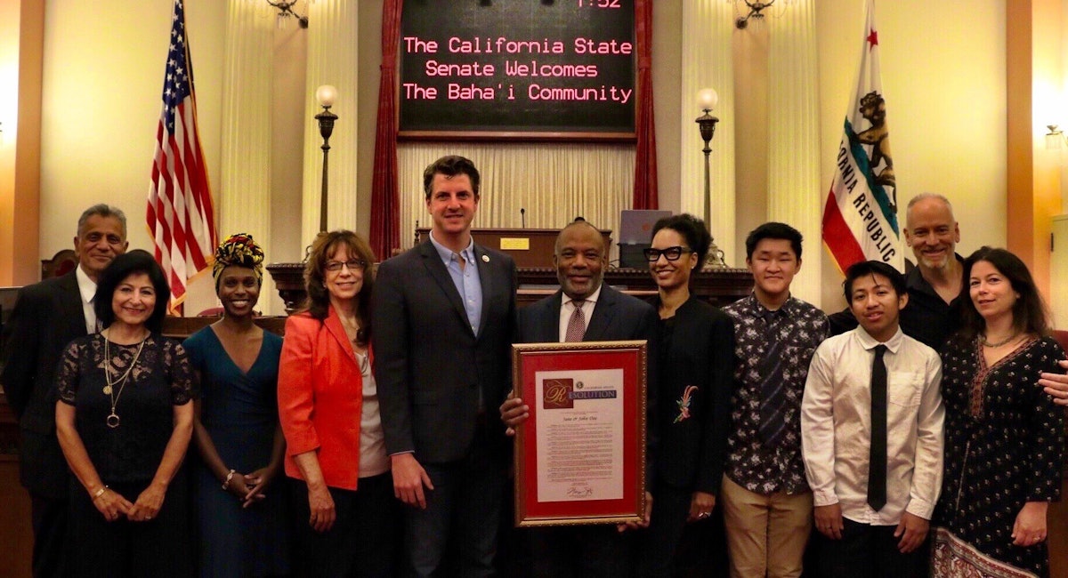 Members of Baha’i communities in California pose for a picture with state Senator Henry Stern (fifth from the left).