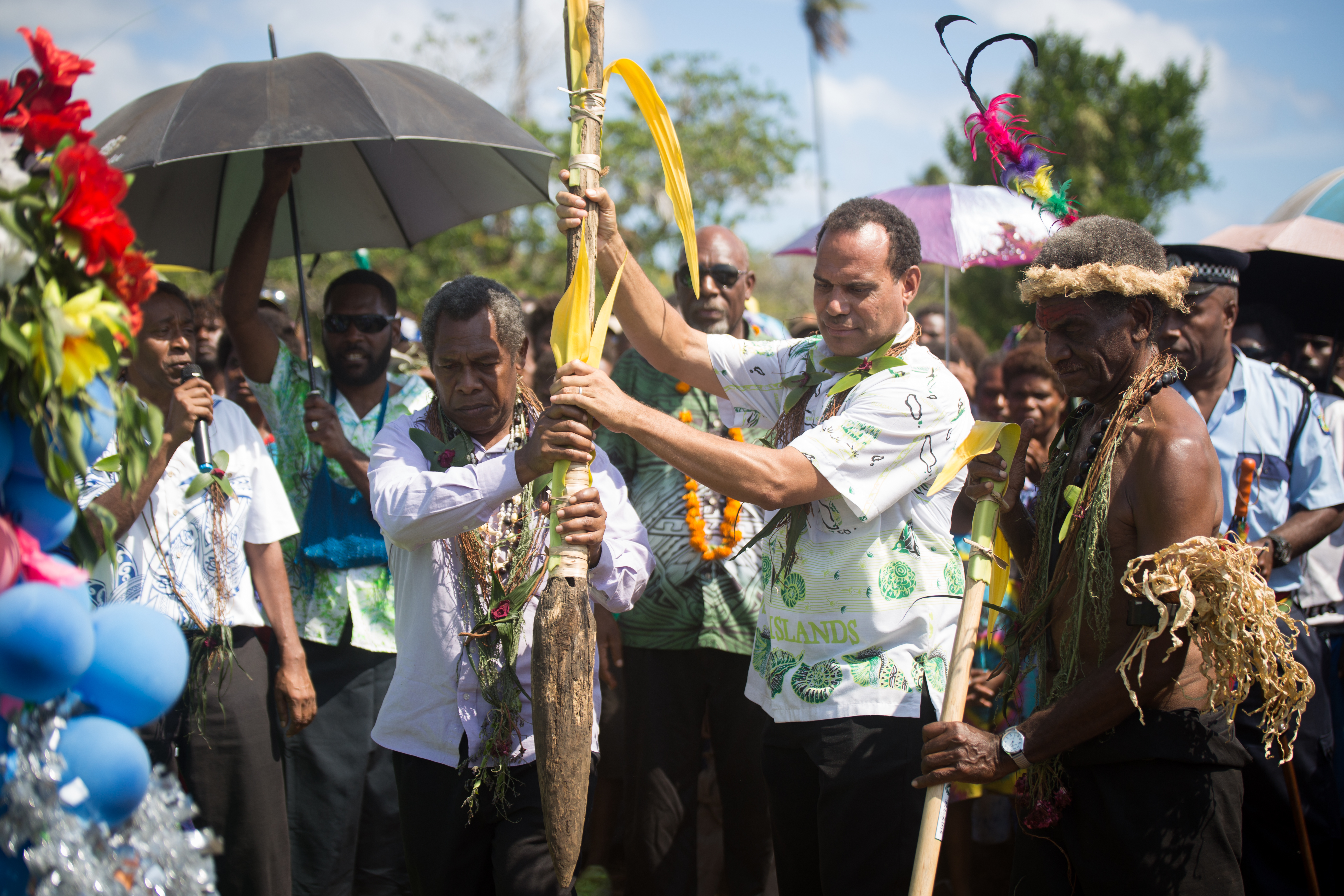 Foreign Minister Ralph Regenvanu (right) and President of the Malvatumauri National Council of Chiefs Willie Plasua together drive the kakel into the soil. Minister Regenvanu represented the national government while Chief Plasua represented the traditional leadership in Vanuatu.