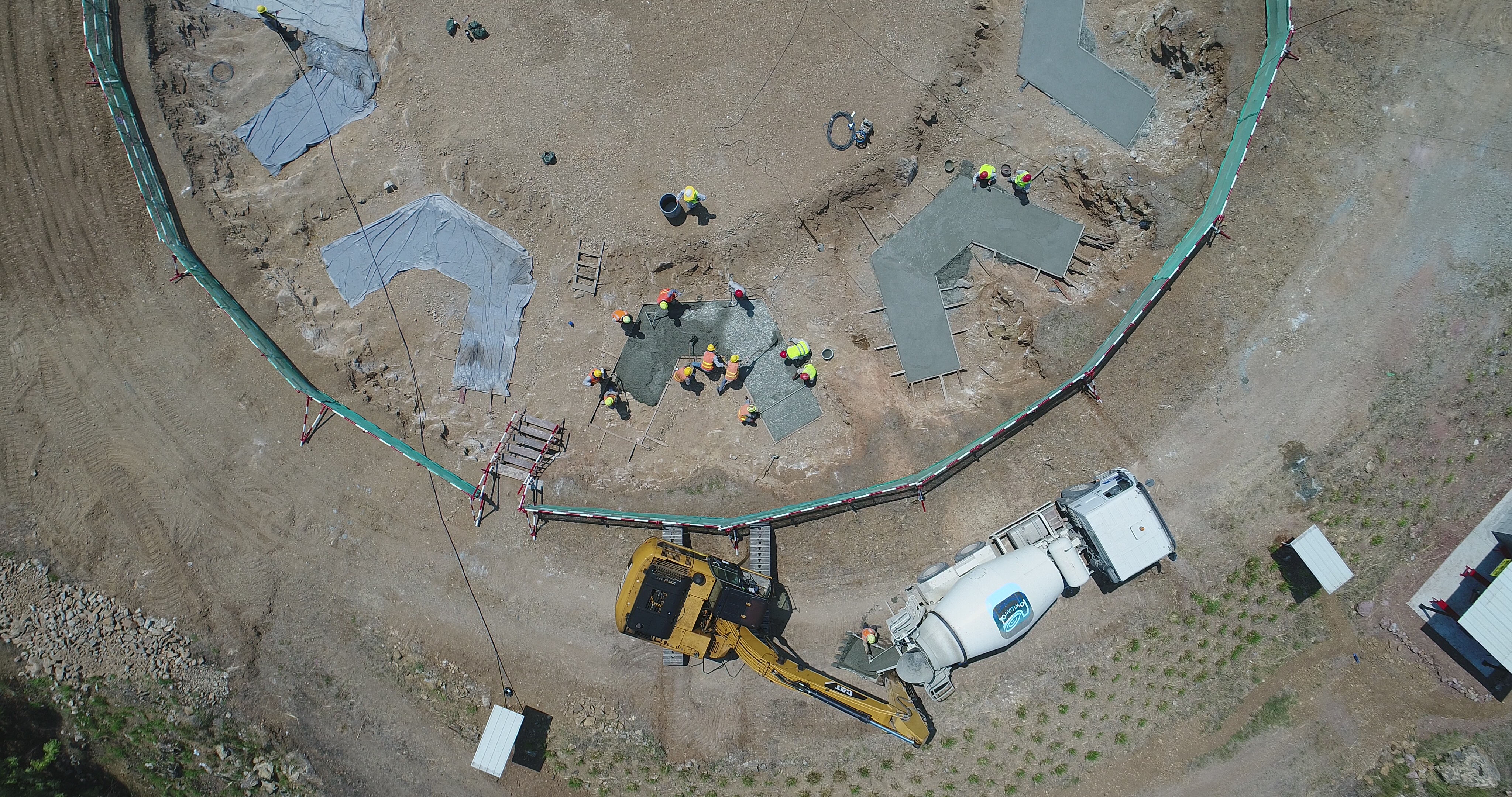 Construction workers prepare the Temple’s foundation earlier in the construction process