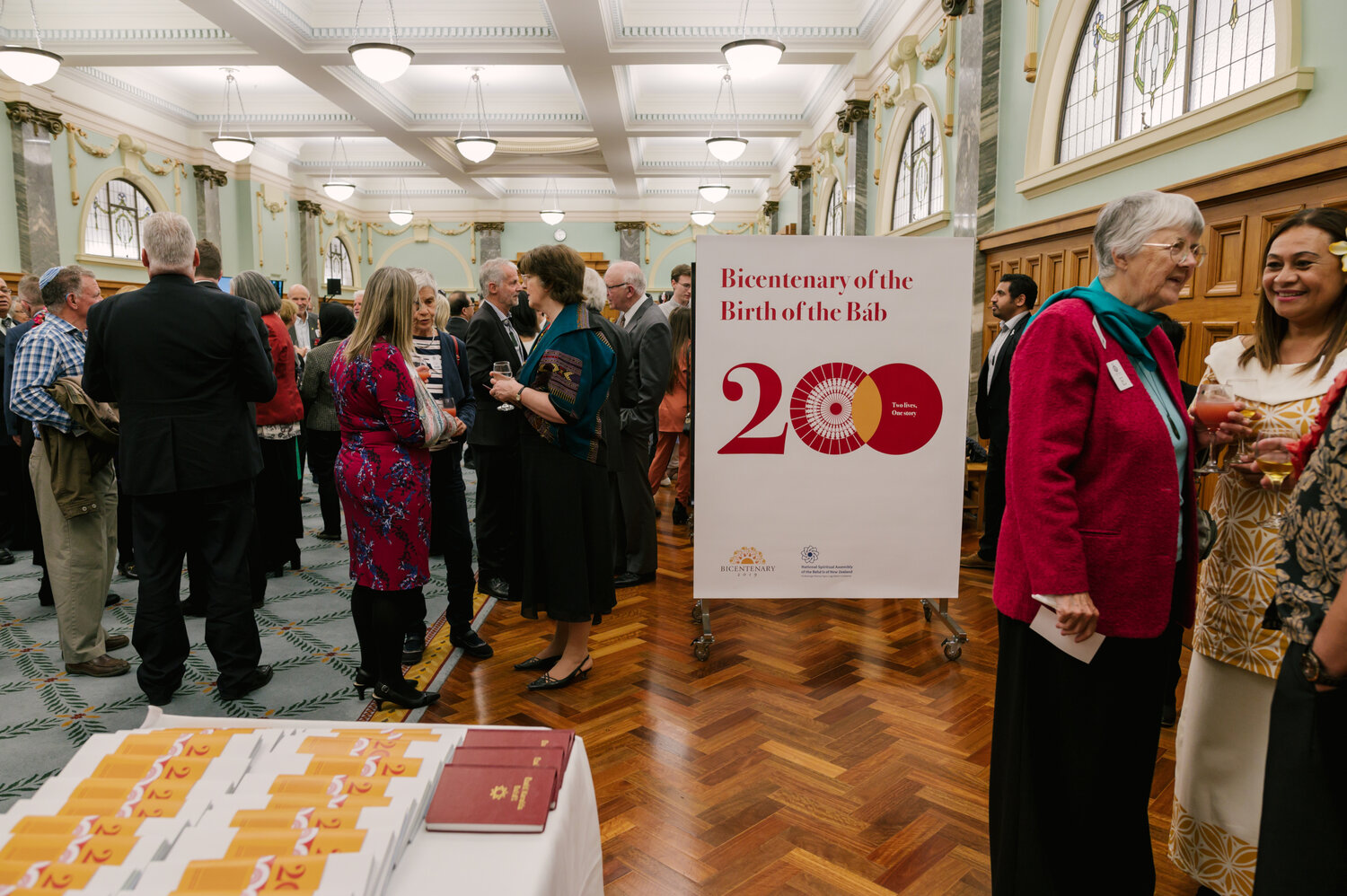 Attendees of a celebration of the bicentenary of the birth of the Bab held at New Zealand’s Parliament Buildings