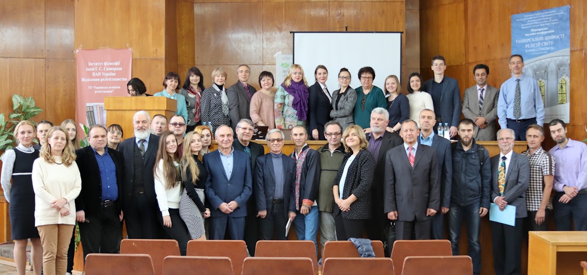 Participants in a conference held in Kyiv, Ukraine, pose for a group photo.